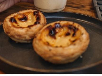Two pastéis de nata on a plate